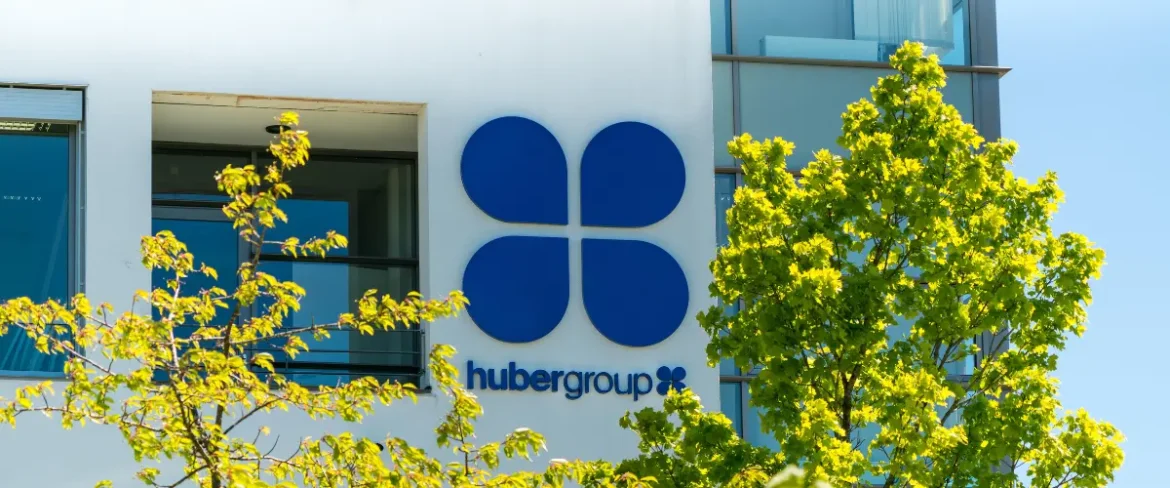 "Hubergroup printing ink containers in a production facility, highlighting nitrocellulose-based product line affected by upcoming price adjustment."